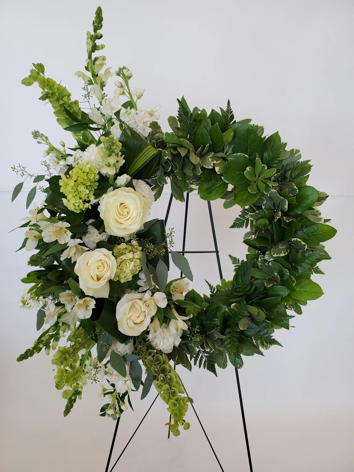 Serene White Blossom Memorial Wreath by Munoz Flower Shop
